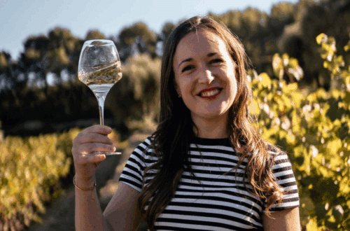 me standing in a vineyard with a glass of white wine