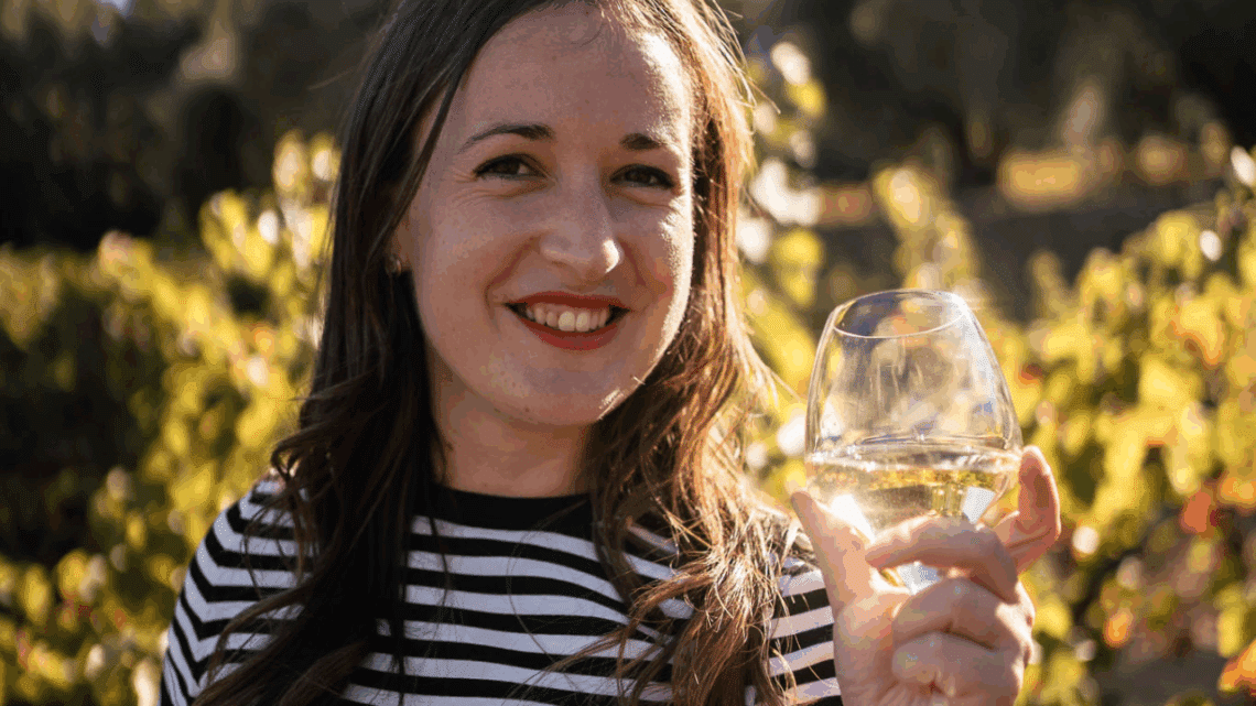 me in a vineyard with a glass of wine