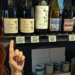 Me in front of Japanese wines on a shelf